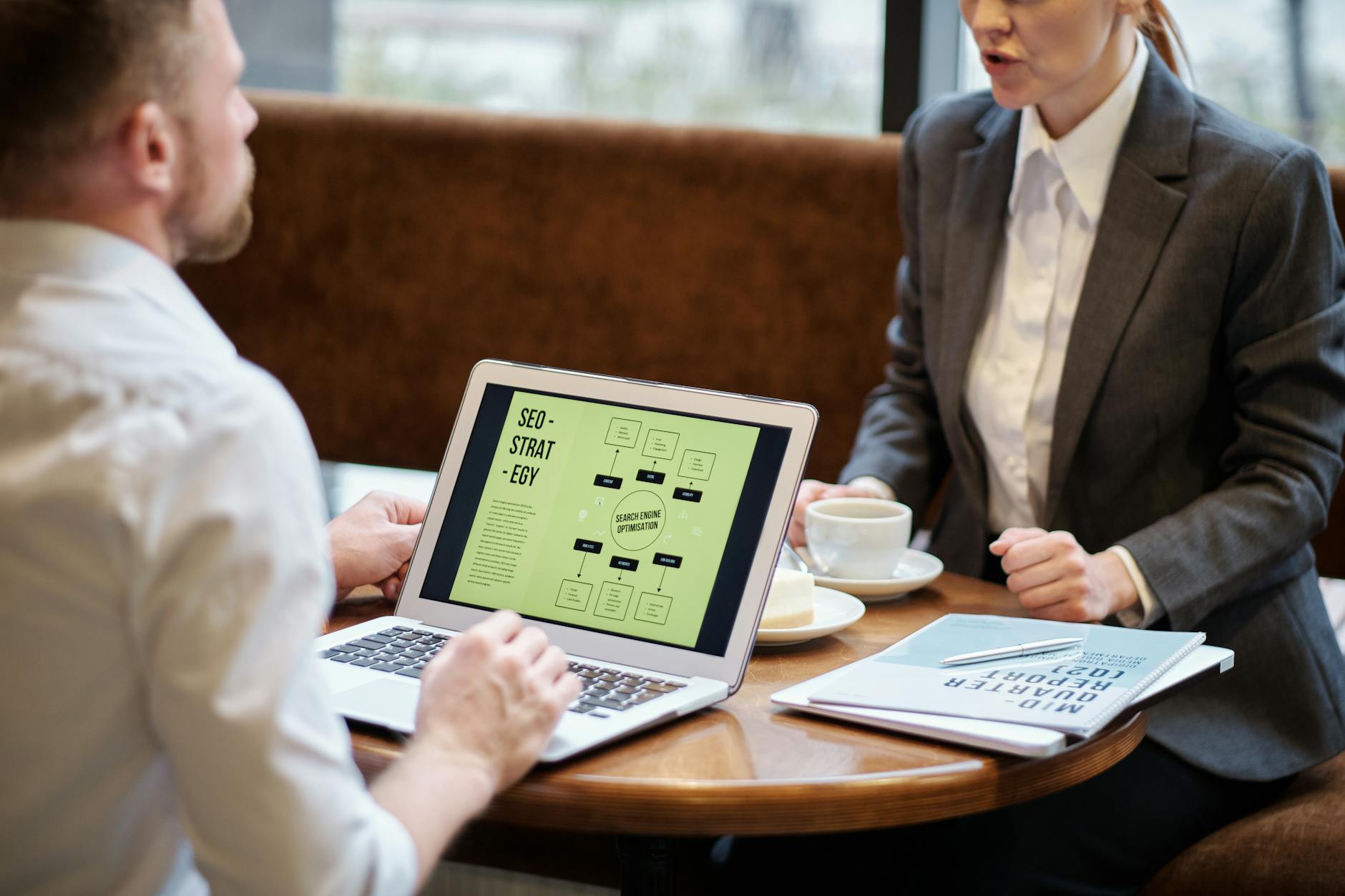 Dynamic graphic of a digital marketing strategist analyzing SEO Best Practices 2026 on a laptop screen.